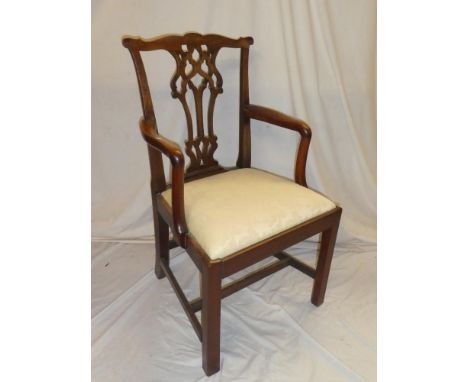 A 19th Century mahogany Chippendale-style carver armchair with pierced vase spat-back and upholstered seat on square legs