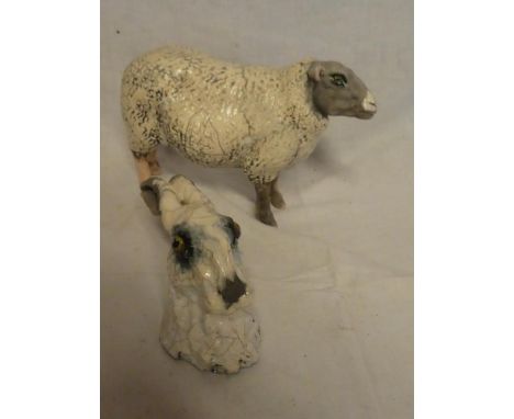 A Studio pottery figure of a sheep by K Rudge 9½" long together with a similar head study of a hare (2)