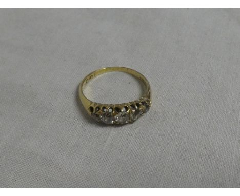 An 18ct gold engagement ring set five graduated diamonds