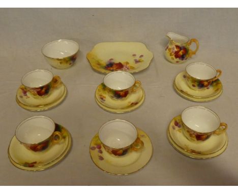 A Royal Worcester china part tea set with painted fruit and flower decoration by K Blake, comprising six tea cups, five sauce