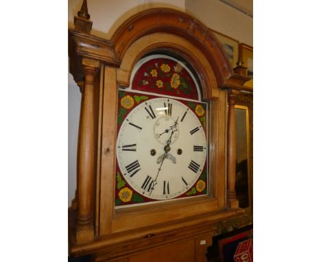 A 19th Century longcase clock with 12" painted arched dial, eight day movement in polished pine traditional case