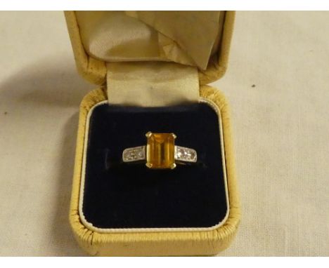 An 18ct gold dress ring set rectangular yellow sapphire flanked by four small diamonds