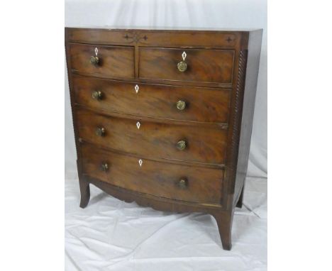 An early to mid-19th Century mahogany bow front chest of two short and three long drawers with brass handles on bracket feet