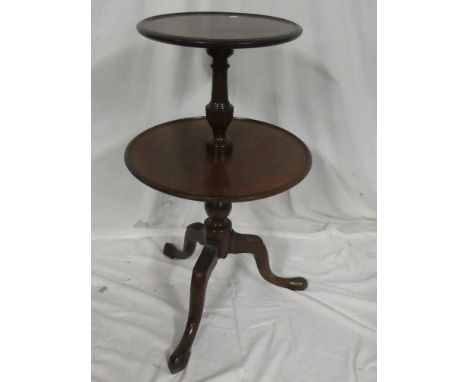 A 19th Century mahogany circular two-tier dumb waiter with turned colomn and tripod base