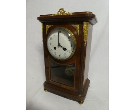 A good quality French mantel clock with circular enamelled dial in brass mounted walnut &amp; maple glazed rectangular case