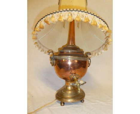 A 19th Century brass mounted copper Samovar with brass tap and oval base, converted to a table lamp