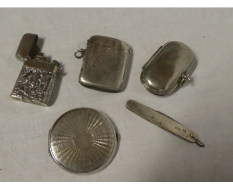 A small silver circular compact with engine turned decoration, silver mounted pen knife, silver rectangular vesta case, silve