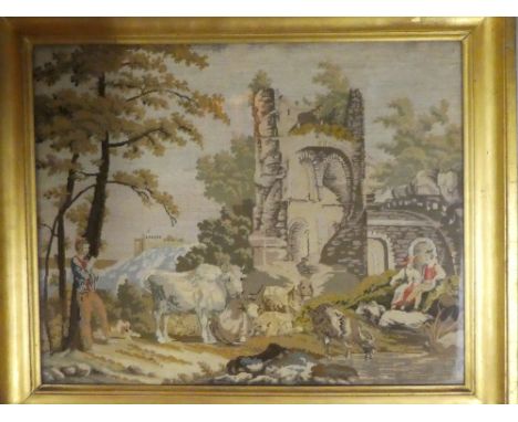 A 19th Century needlework rectangular tapestry depicting ruined landscape with figures and animals