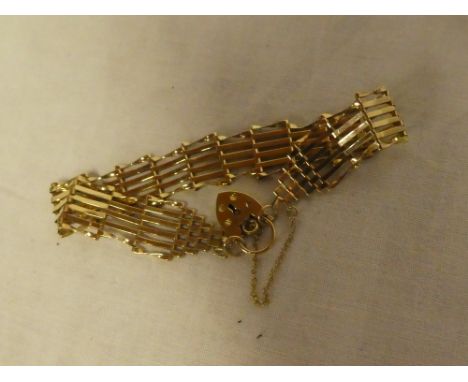 A 9ct gold gate-link bracelet with padlock clasp