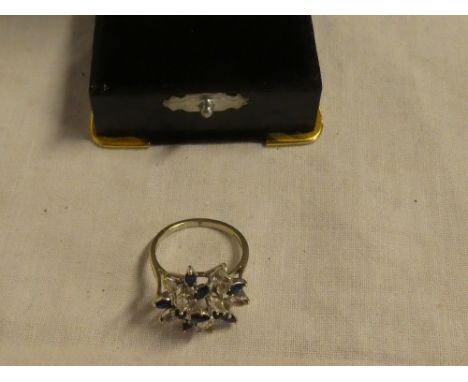 A 9ct gold dress ring set blue &amp; white stone cluster