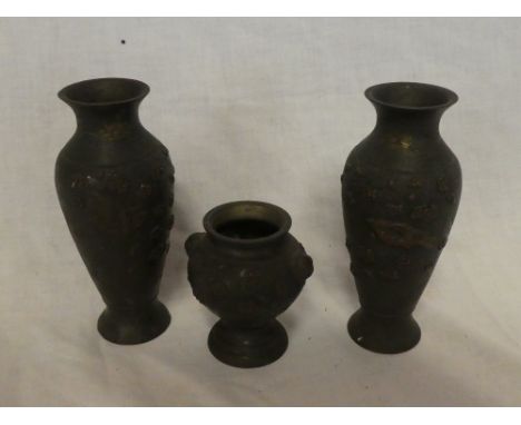 A pair of Japanese bronze tapered vases decorated in relief with birds and flowers, 6" high and one other similar smaller vas