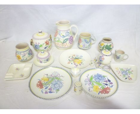 A selection of various Poole pottery including floral tapered jug, biscuit barrel, various vases, dishes, etc
