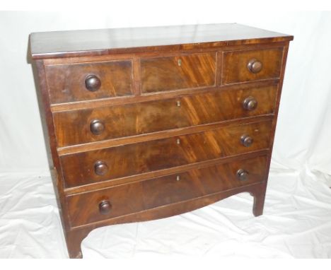 A 19th Century mahogany chest of three small drawers above three long drawers with turned handles on bracket feet