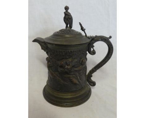 A 19th Century bronze and silver plated ornamental lidded jug decorated in relief with numerous classical figures, scroll han