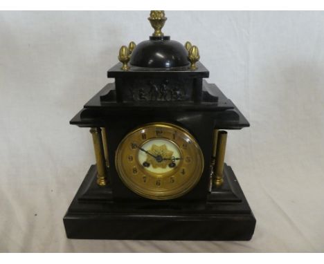 A Victorian mantel clock with gilt circular dial in brass mounted black slate pavilion style case