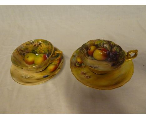 Two Royal Worcester china cups and saucers with painted fruit decoration, one signed Kyer, the other Ricketts (2)