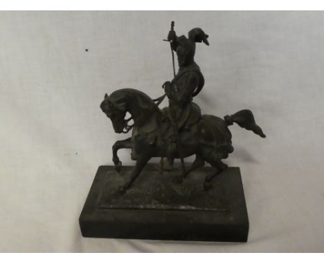 A good quality bronze figure of a Medieval Knight on horseback, 7" high on a polished slate base