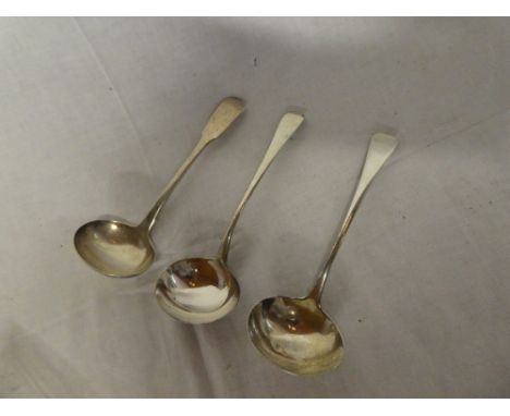 A pair of George III silver "Old English"pattern sauce ladles, London marks 1810, and a George III silver "Fiddle" pattern sa