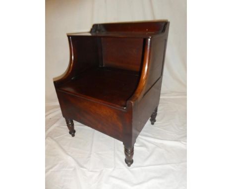 A 19th Century mahogany commode with hinged lid on turned tapered legs
