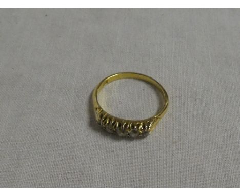 An 18ct gold engagement ring set five graduated diamonds