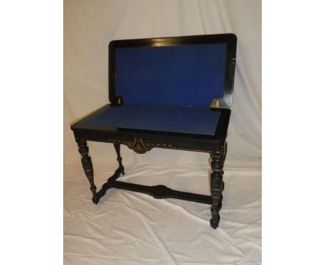 A late Victorian burr walnut and ebonised rectangular turn-over top card table with baize lined playing surface on turned leg