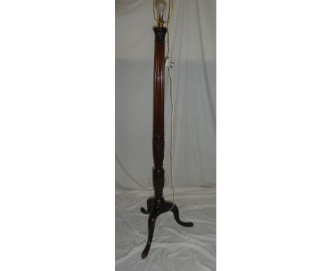 A good quality carved mahogany standard lamp with fluted column and tripod base