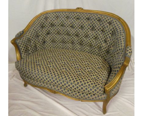 A good quality French-style two-seat settee with gilt curved frame upholstered in button fabric