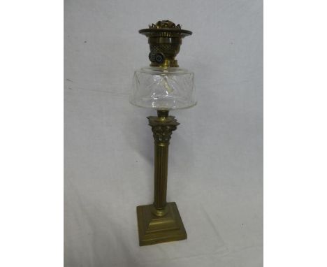 A good quality brass Corinthian column oil lamp with cut glass reservoir, 22" high