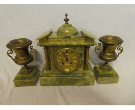 An impressive mantel clock with gilt circular dial in brass mounted onyx pavilion style case together with a pair of matching
