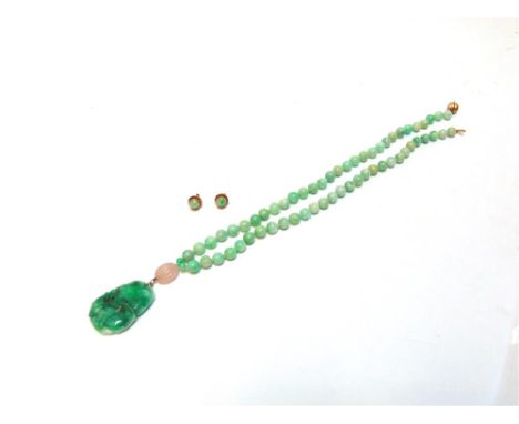 A UNIFORM JADE BEAD AND PENDANT NECKLACE the fifty nine beads of approximately 8-8.5mm, with two additional beads of 4.9mm, w