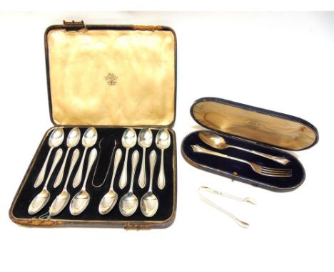 A CASED SET OF A DOZEN SILVER TEASPOONS with tongs; a cased silver fork and spoon set; and a silver pair of sugar tongs; 310g