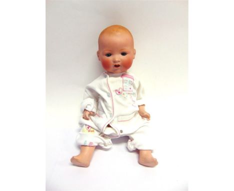 AN ARMAND MARSEILLE BISQUE SOCKET HEAD DOLL with moulded and spray-painted hair, sleeping blue-grey glass eyes, and an open m