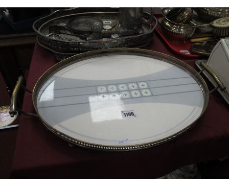 WMF' An Art Deco Oval Tray, the ceramic panel with geometric design in green and blue within galleried frame with angular twi