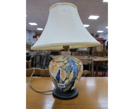 A Moorcroft Pottery Table Lamp, painted in the 'Windrush' design by Debbie Hancock, 19cm high, wooden base with cream shade.