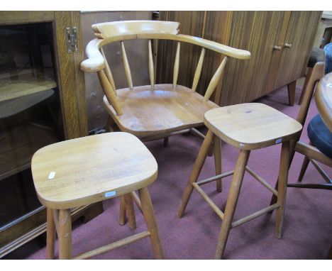 A Captain's Chair, in the Ercol manner, two stools. (3)
