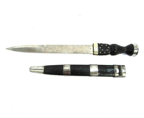 A Scottish dirk, the engraved thistle design blade by Robert Mole &amp; Sons of Birmingham marked 98 joining the grip with fe