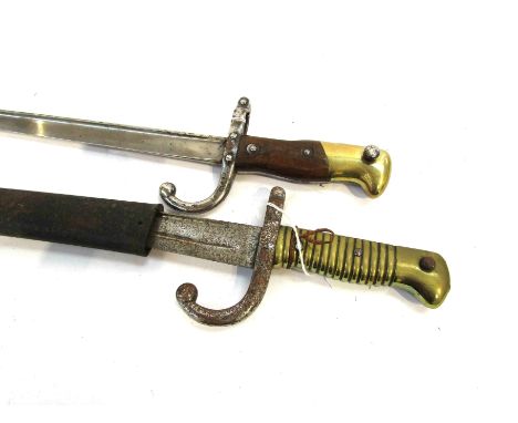 A French Gras bayonet (no scabbard) dated 1877, together with a Chassepot sabre bayonet with scabbard stamped 76563 to guard 