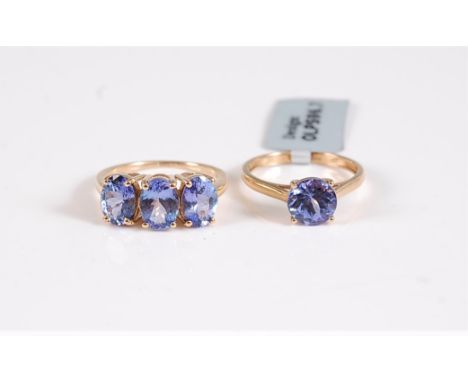 Two 9ct tanzanite rings, the first a three stone tanzanite ring, hallmarked Birmingham 2011, size N-O, and a single stone tan