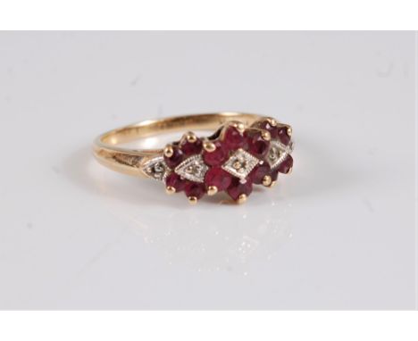 A 9ct ruby and diamond highlight ring, the round ruby clusters set to centre with a small diamond highlight and a further hig