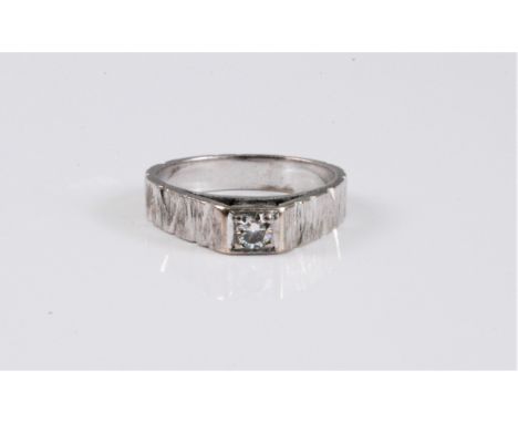 An 18ct white gold diamond solitaire ring, the round brilliant cut diamond, estimated approx. 0.20cts, claw mounted within a 