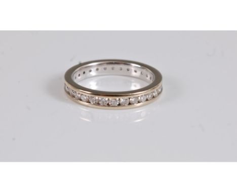 An 18ct diamond eternity ring, the full hoop eternity ring set with round brilliant cut diamonds, total estimated approx. 0.7