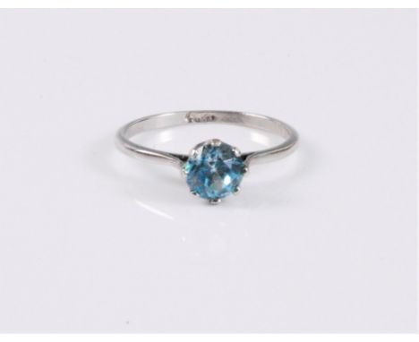 A blue zircon ring, the round pale blue zircon, approx. 6mm diameter, claw mounted with plain platinum band, stamped 'Plat', 