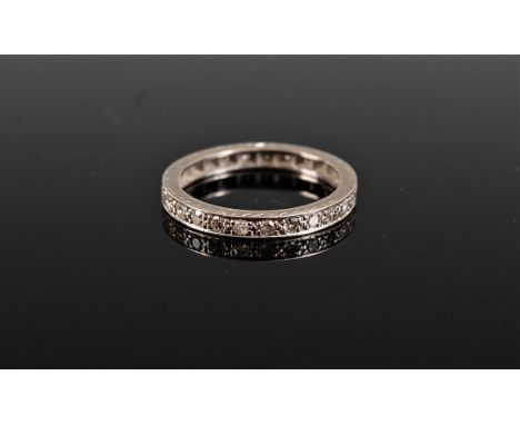 A diamond eternity ring, the round brilliant cut diamonds, total estimated approx. 0.25cts, all set in unmarked white metal (