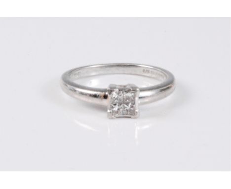 A platinum and diamond ring, the four princess cut diamonds, total weight estimated approx. 0.20cts, in a rubover mount with 