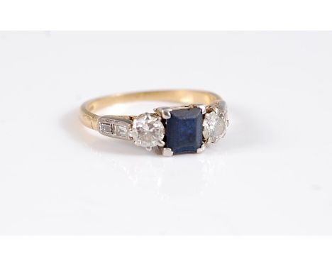 An 18ct sapphire and diamond ring, the square step cut sapphire, set to either side with a round brilliant cut diamond and tw