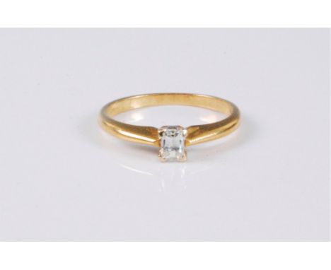 An 18ct fancy cut diamond ring, the fancy cut diamond, estimated approx. 0.26cts, in a four claw mount with tapered shoulders