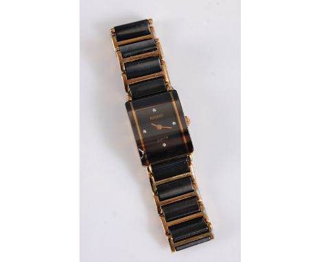 A lady's Rado Jubile quartz wristwatch, the signed rectangular ceramic dial with diamond quarter hours, gilt hands, 17 x 22mm