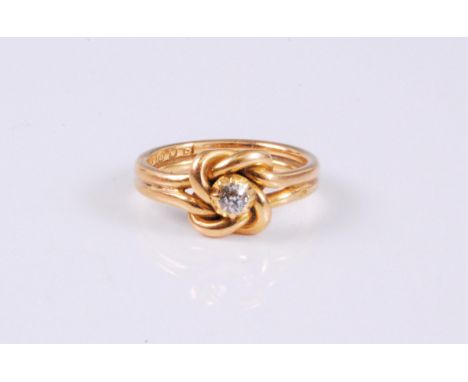An 18ct diamond knot ring, the old cut diamond, estimated approx. 0.10cts, set centrally to a two strand knot of yellow gold,