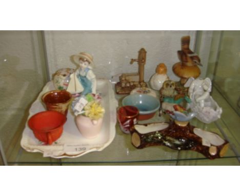 Shelf of decorative ornaments including Coalport figure Ship Ahoy, Mary Gregory cranberry glass cup, bisque tea cup, Chinese 