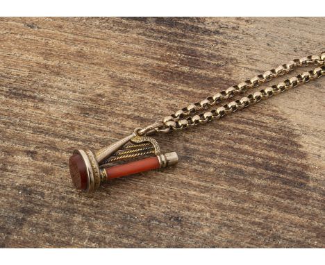 A late 19th early 20th century yellow metal belcher linked chain,  with a coral and yellow metal charm, modelled as a harp wi